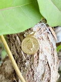 Gold coin charm with royal portrait
