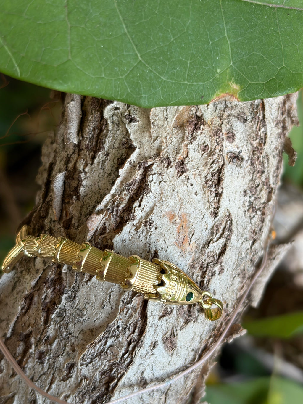 Gold Articulated Fish Charm with Emerald Eye