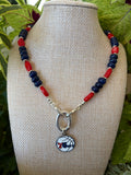Lapis and red rice bead 76ers necklace with silver toggle clasp on mannequin bust