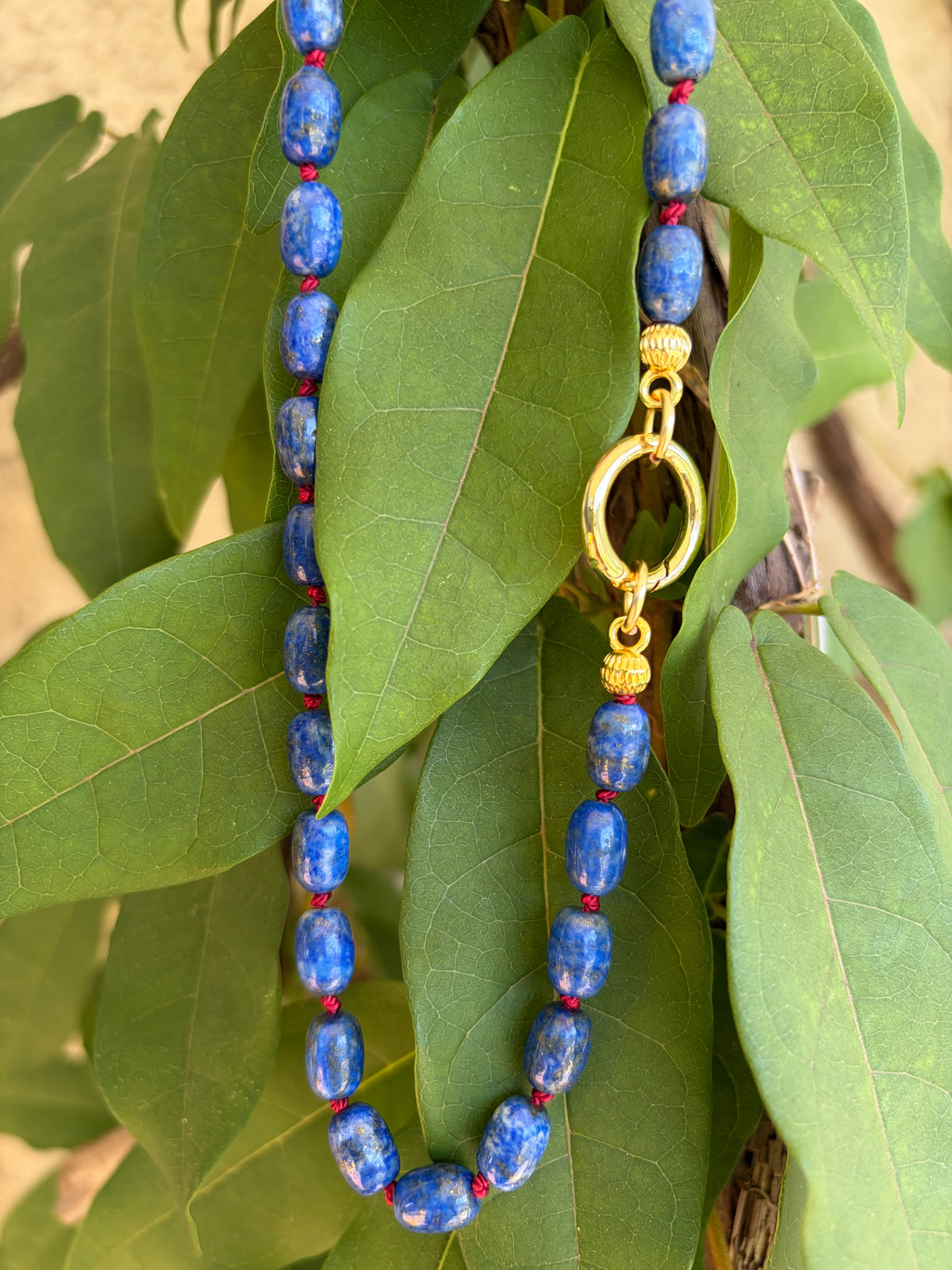 Lapis lazuli beaded necklace on mannequin bust front view